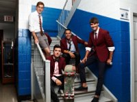 Big Time Rush  Posed shot of the band seated on a high school stairwell.